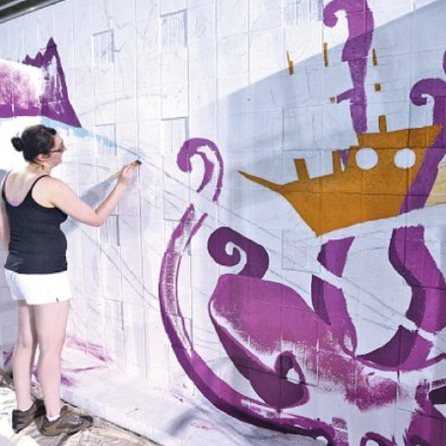 Emily Chase has started her mural at the Springdale Aquatic Center! Be sure and grab today's paper to read another article about #teamspringdale and the mural project!  (photo by Samantha Baker of @nwaonline)